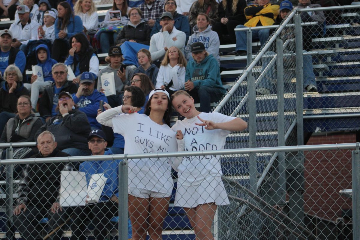 Seniors Lauren Nelson and Anela Grubish pose for pic from the stands. 