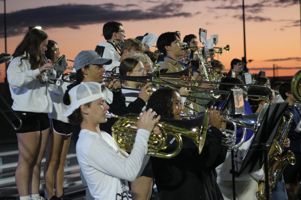 OHS pep band perform during halftime with joyful cheer.