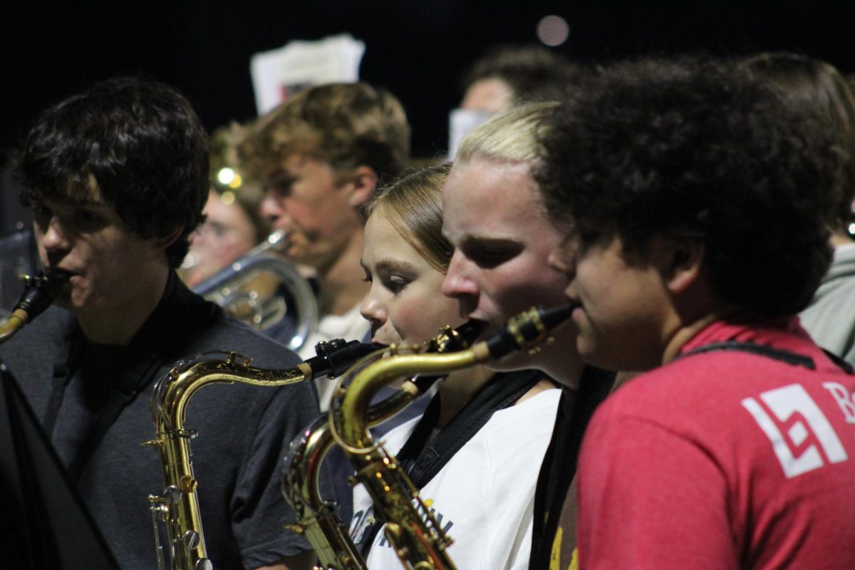 OHS pep band saxophone section perform to the student section. 