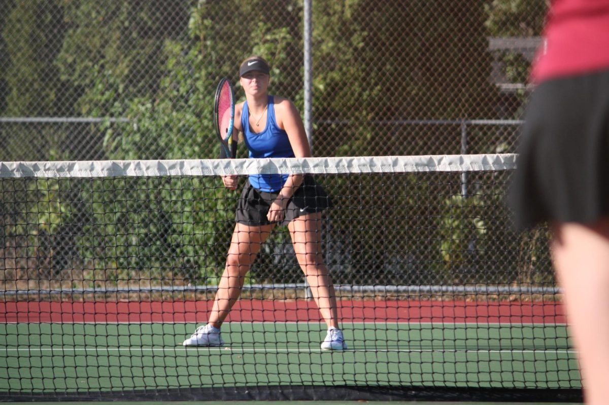 Junior Harper Shives gets ready for the ball to get served to her.