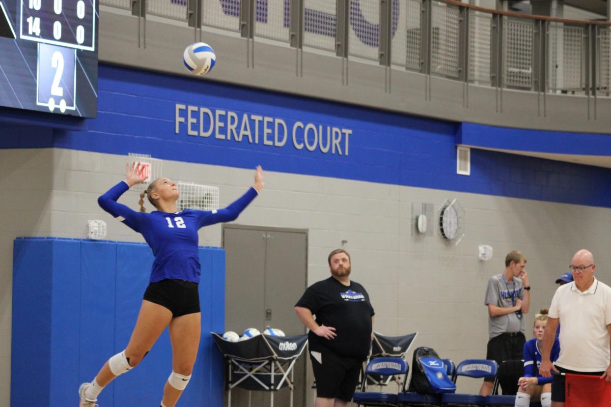 Junior Kendra Bogen serves the ball to opposing team.