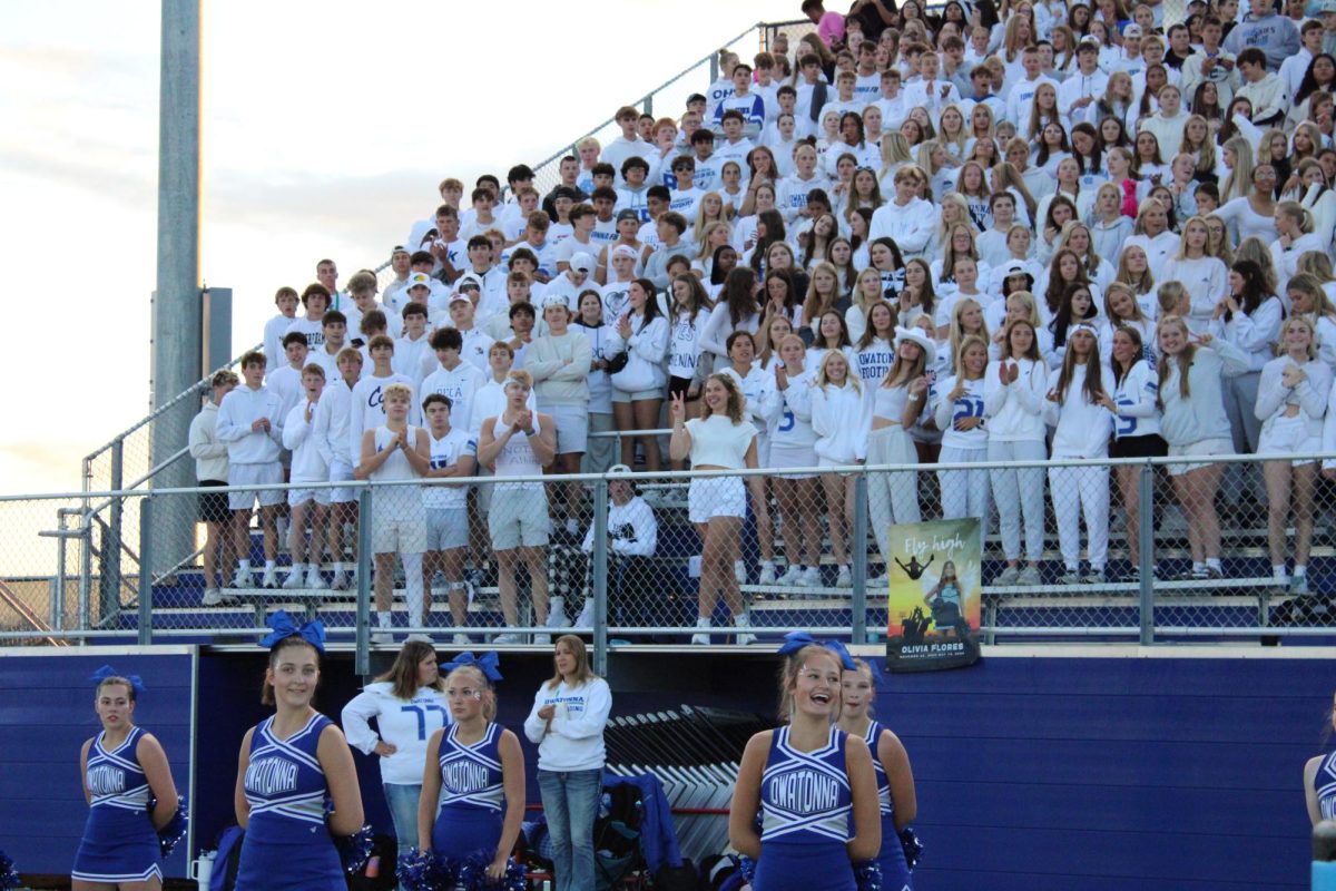 The student section and OHS cheer team look out happily at the game. 