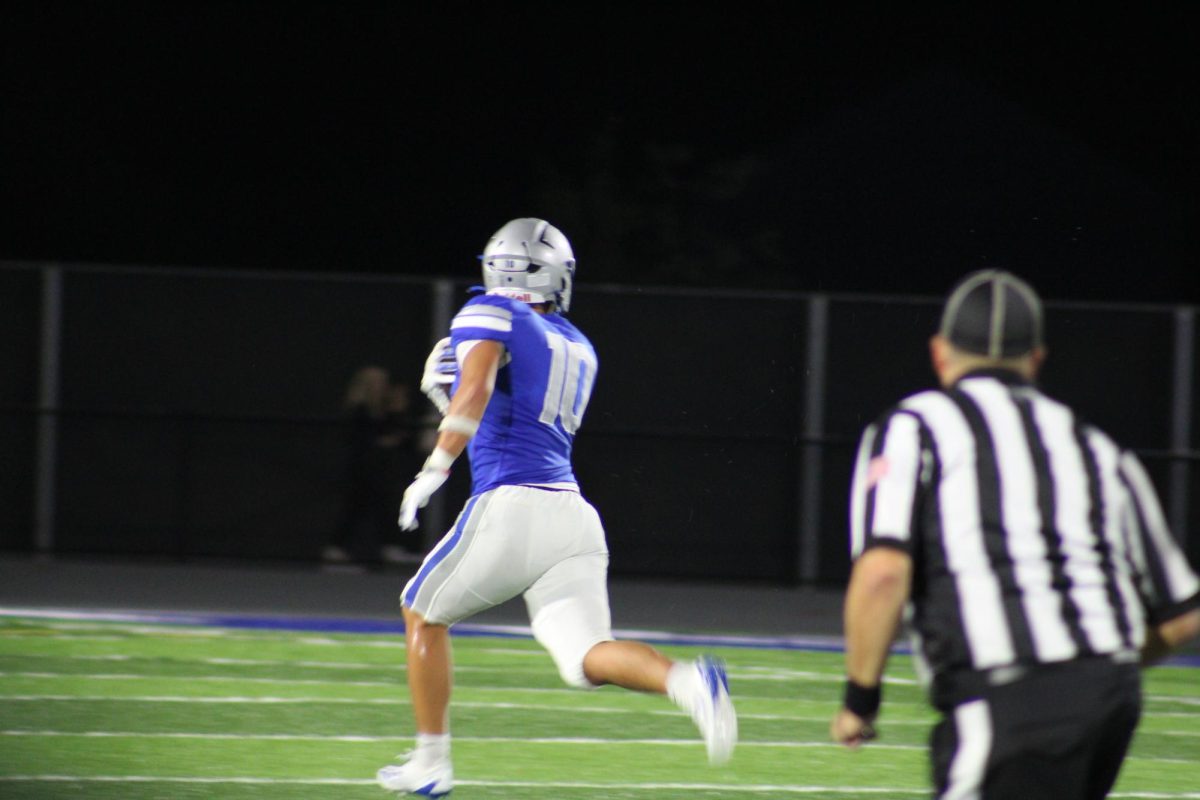 Senior Blake Fitcher retrieves fumble and runs to the Huskies' endzone. 