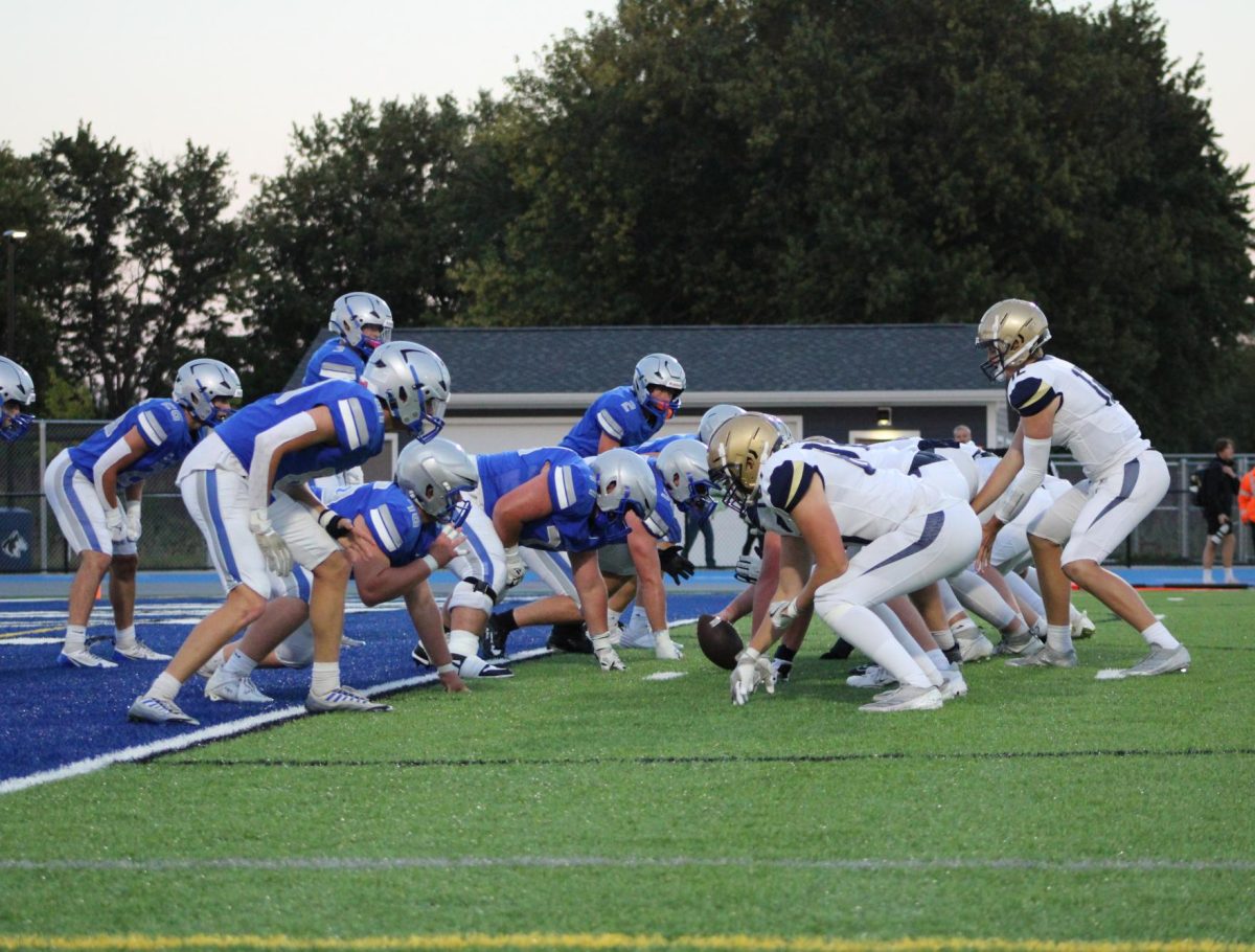 Huskies' defensive line prepare for the ball to snap.