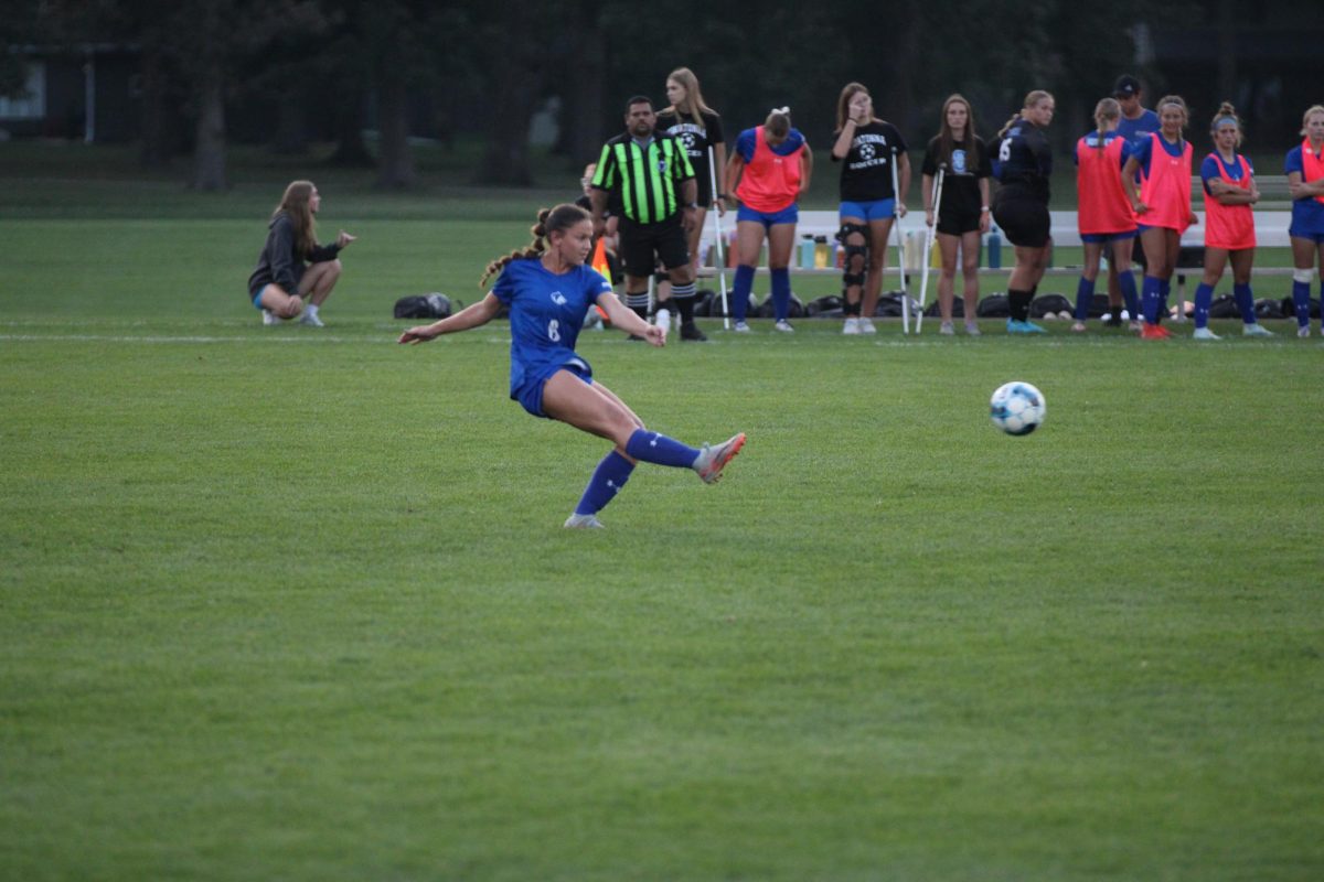 Senior Izzy Muir takes a free kick after a foul is called. 