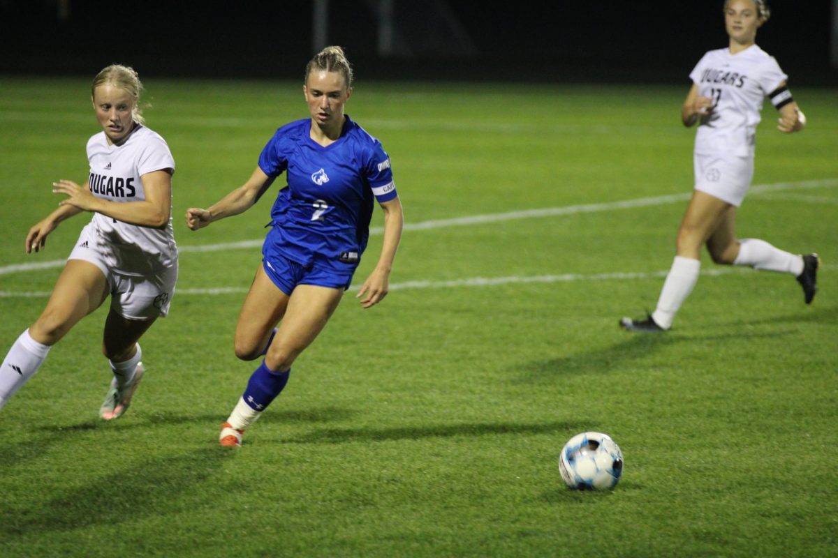 Senior Kennedy Schammel looking ahead to attack the ball.