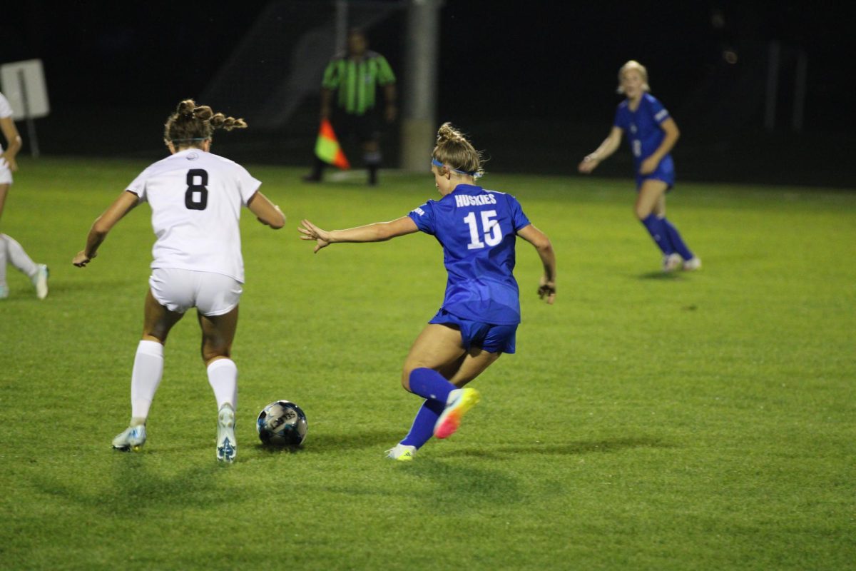 Presley Schammel defending the ball form a Mankato Cougar.