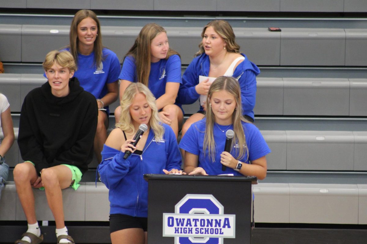 Seniors Kennedy Katzung (L) and Norah Kath (R) introduce themselves to kick off the pep fest.