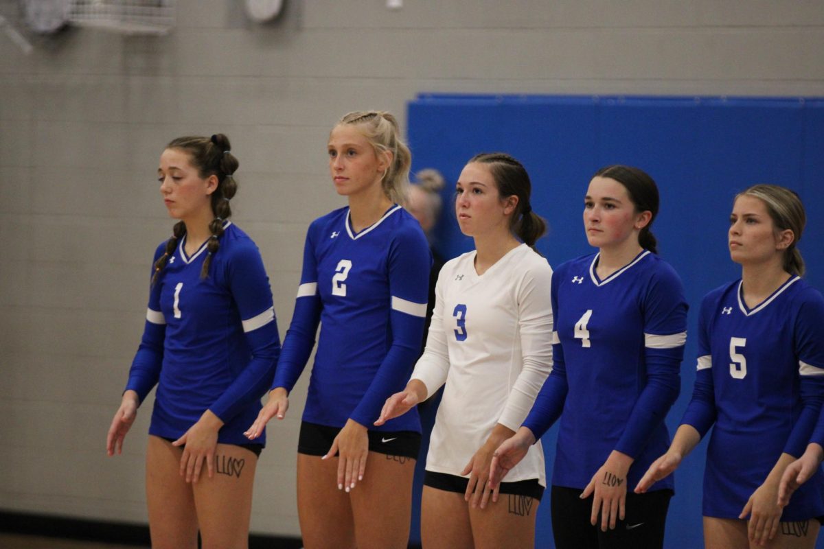 OHS Girls Volleyball line up for introductions before the game.