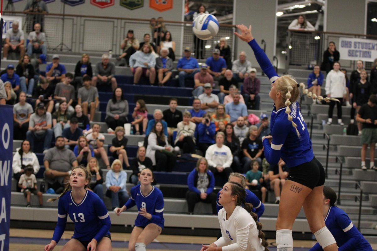 Junior Libby Jensen attempts to spike the ball. 