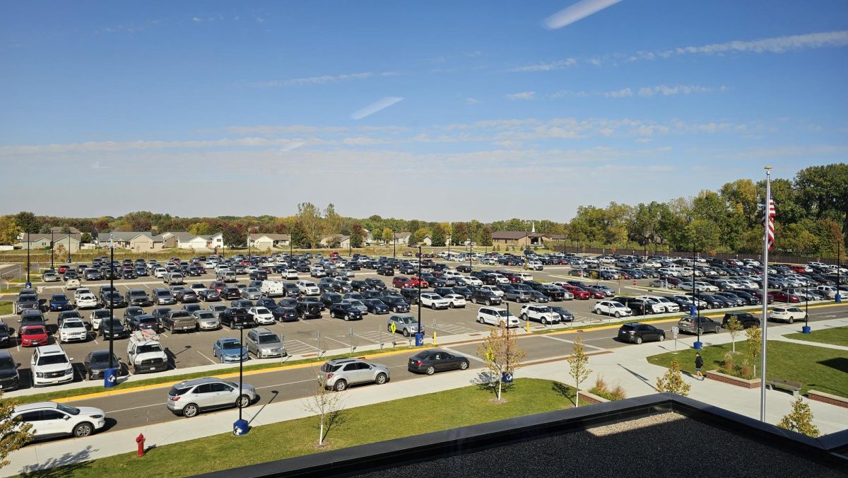 OHS parking lot filled with cars during the school day. 