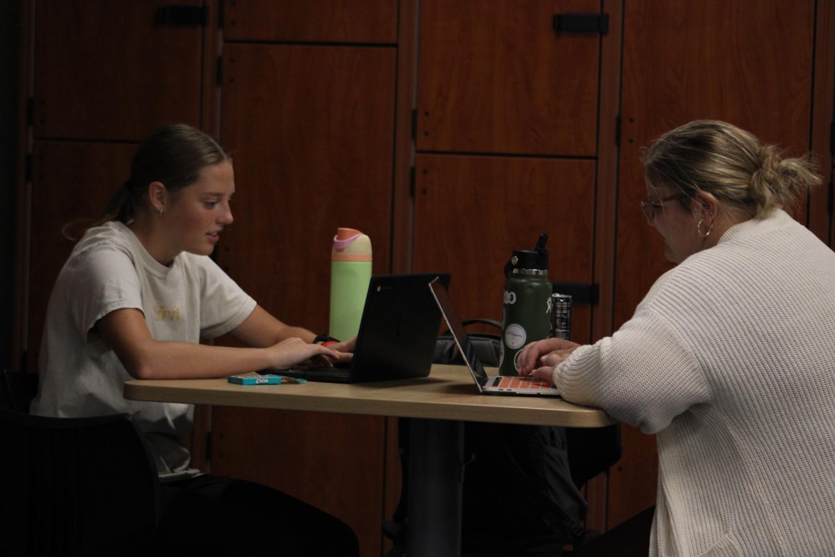 Isabella Shultz and Maddy Reese in the music wing working hard.