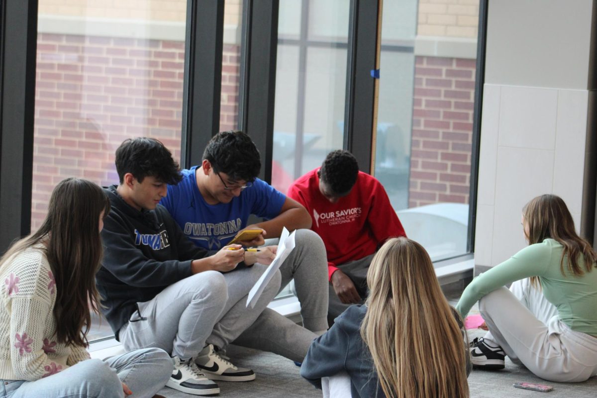 Amilio Garza and others working on a school project.