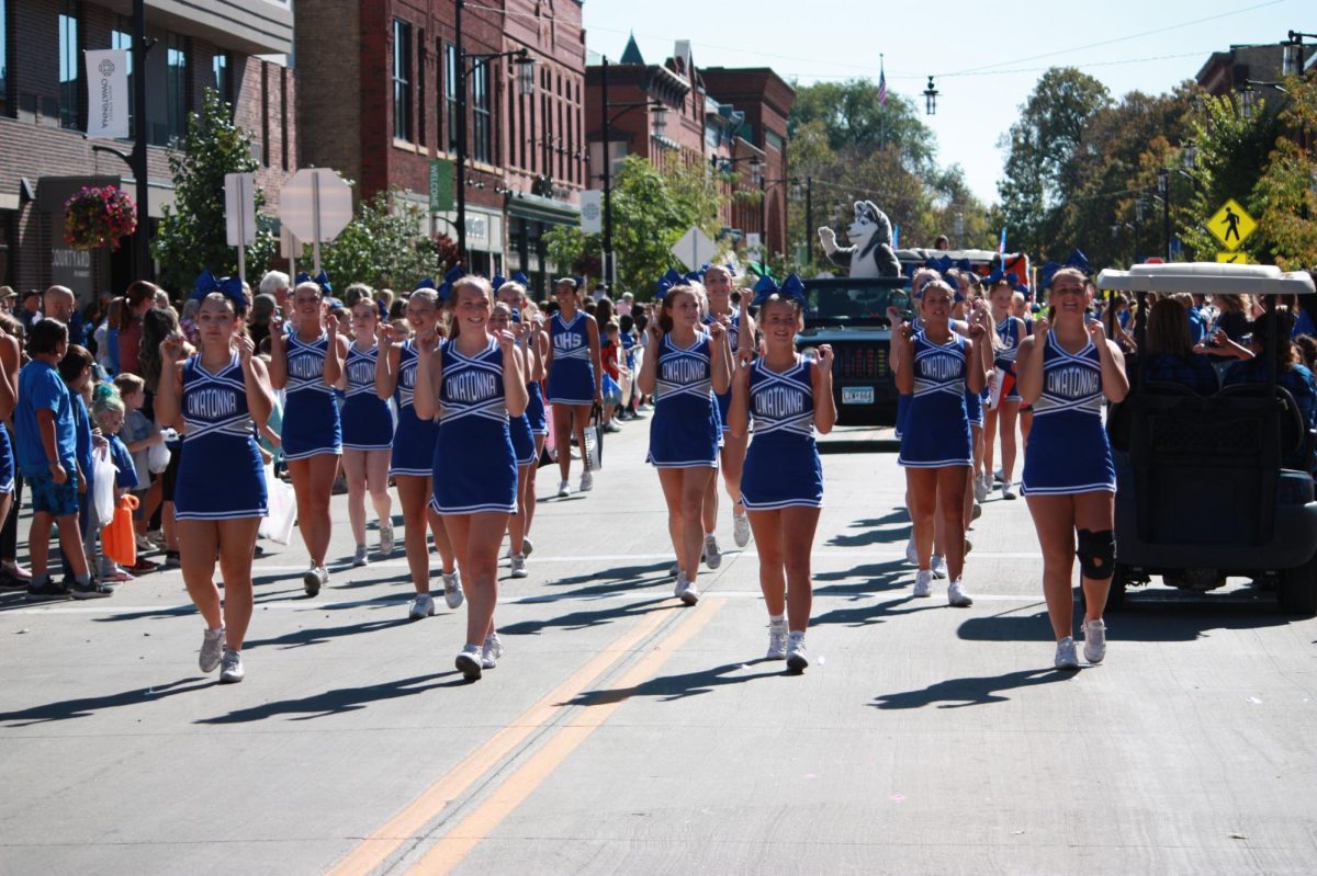 Owatonna Cheerleaders cheer their way through the parade.