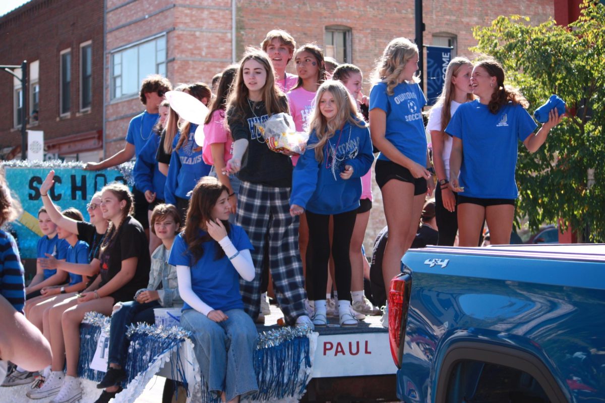 Owatonna Student Council members enjoy the parade after there hard work. 