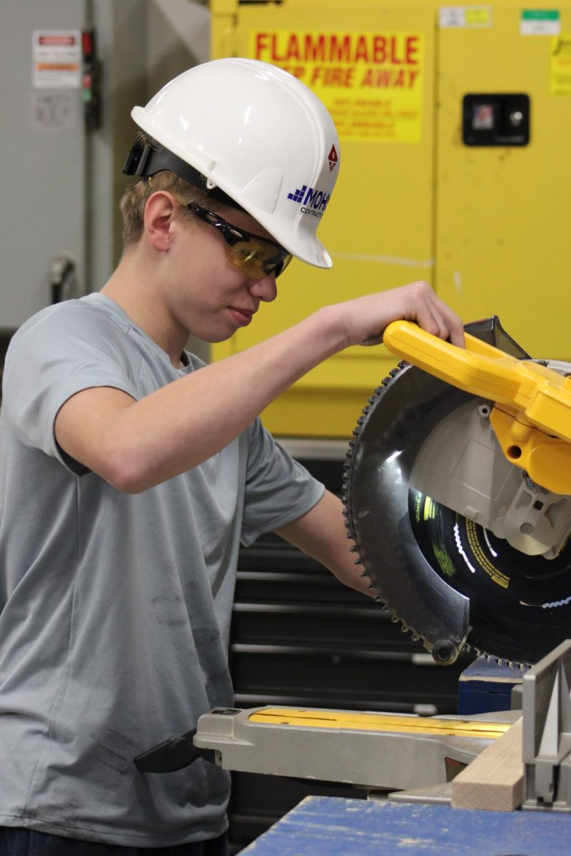 Blake Rezac working with the Miter saw.