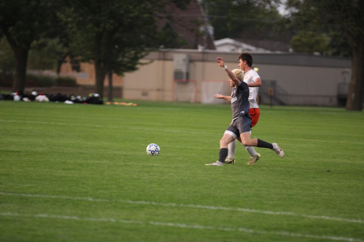 Sophomore Jack Hawkins fighting for the ball.