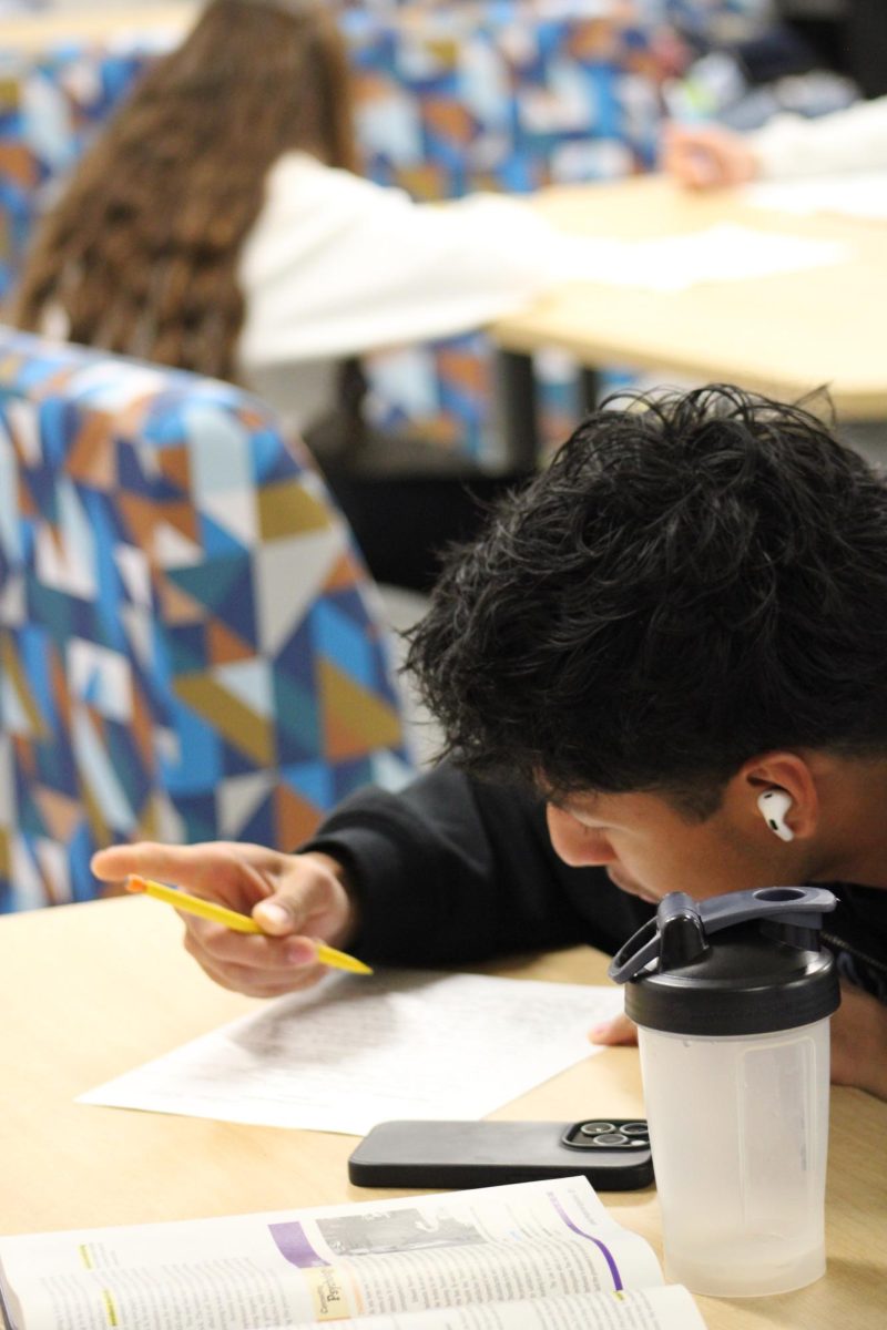 Senior Juan Patino is working on his psychology work.