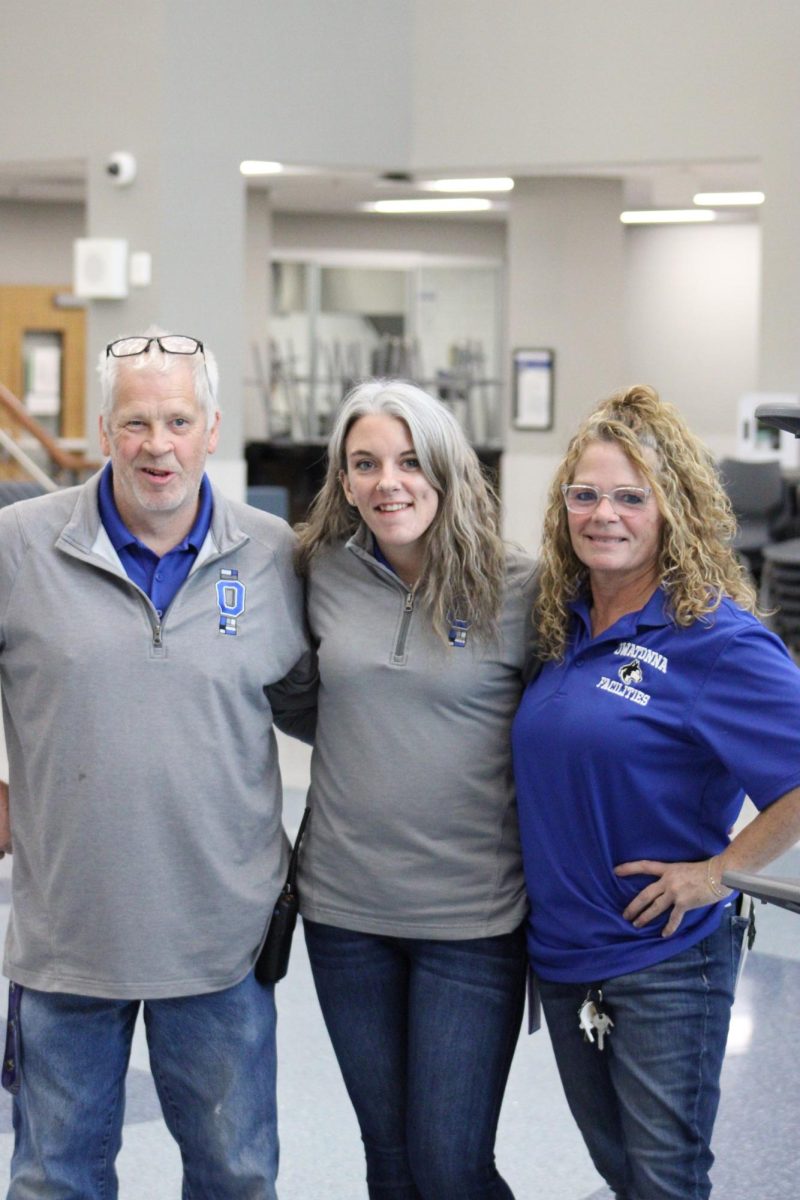 The three "day shift" custodians pose for a picture