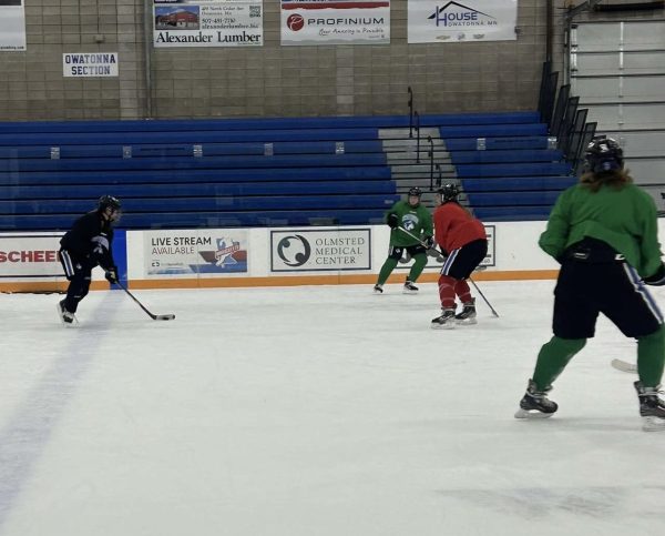 OHS Girls hockey moves the puck as they do a drill for tryouts. 