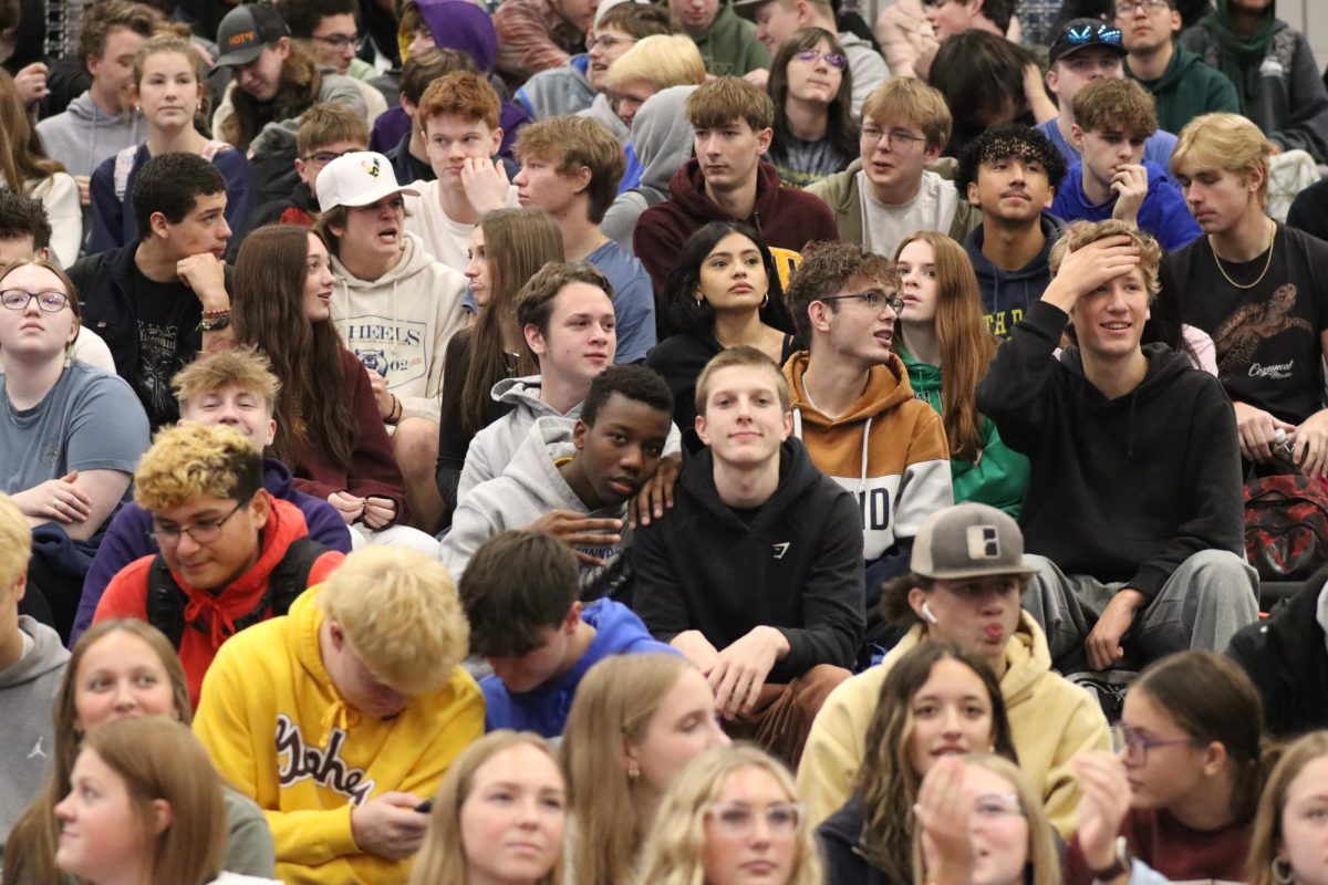 The OHS junior student section enjoys their time with one another prior to the pep fest. 