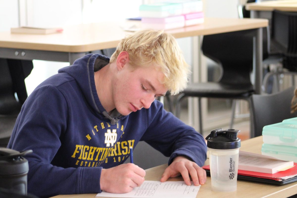 Sophomore Jack Hawkins is working on his English assignment.