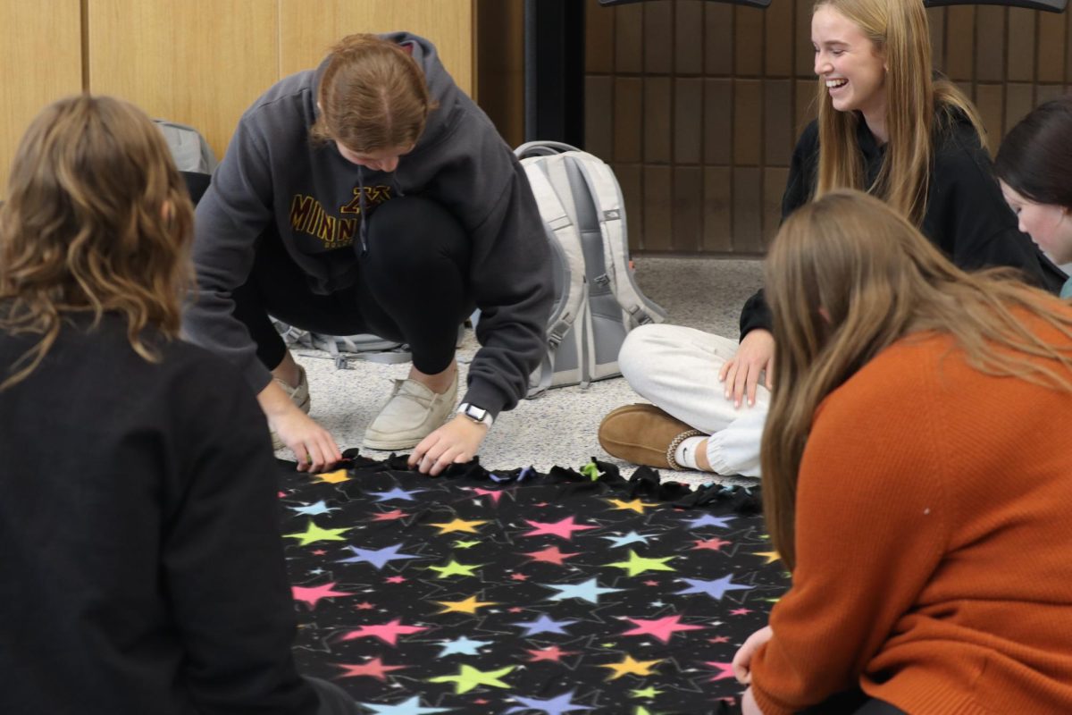 The OHS students making tie blankets to collaborate with Toys for Tots.  