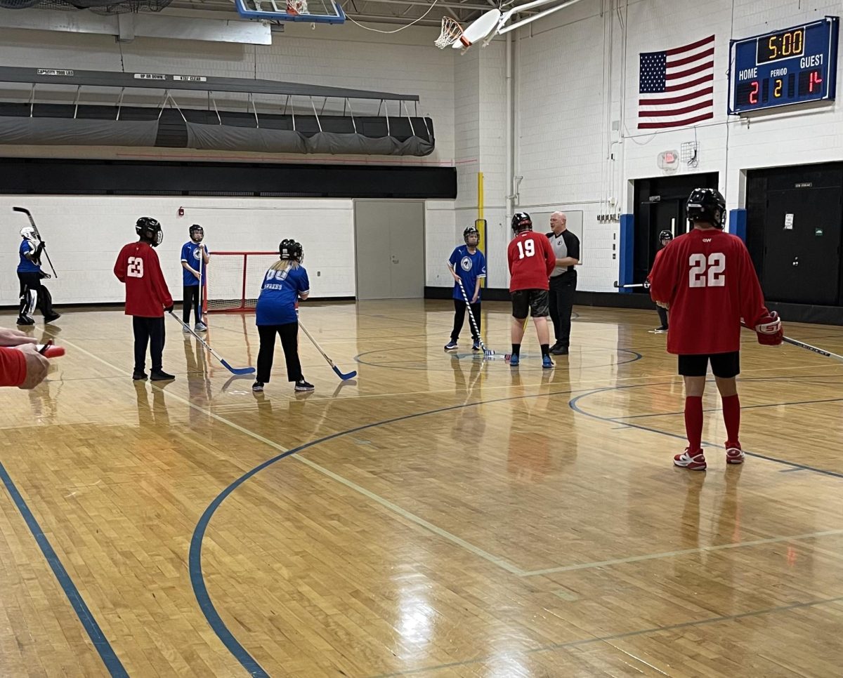 The OHS Adaptive Floor Hockey prepare for face-off for the second half. 