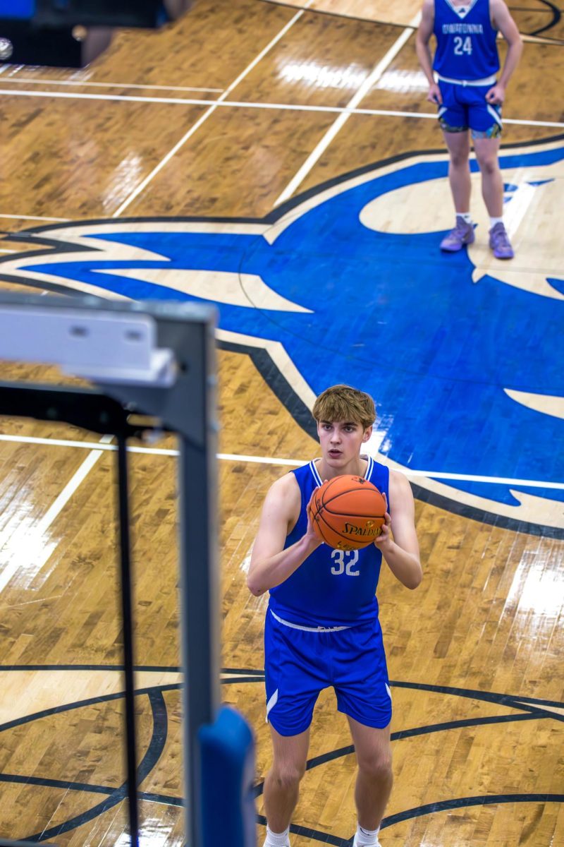 Sophomore Brice Spindler prepares to shoot a free-throw to increase their score.  