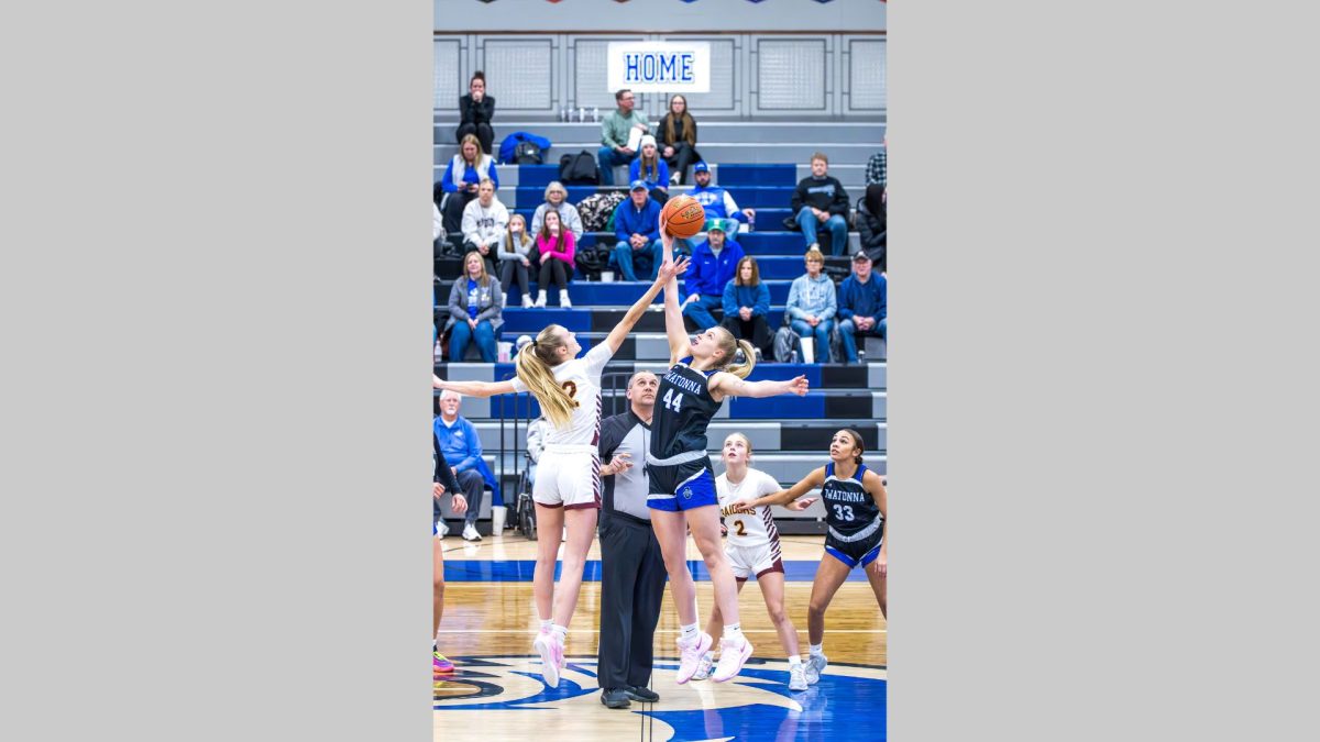 Ava Olson wins the jump ball for the Huskies against the Northfield Raiders.

