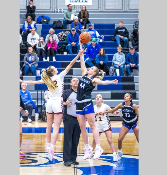 Ava Olson wins the jump ball for the Huskies against the Northfield Raiders.

