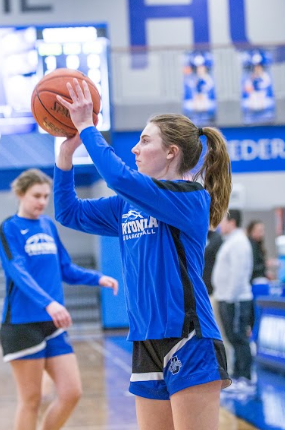 OHS Senior Abby Shornock during warm-ups before a game. 