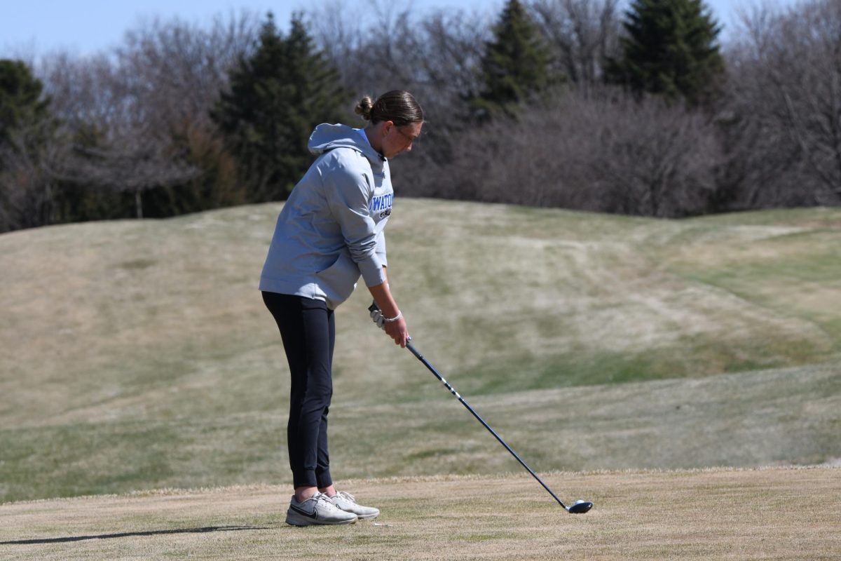 OHS Senior Captain Anna Mollenhauer teeing up for her next shot. 