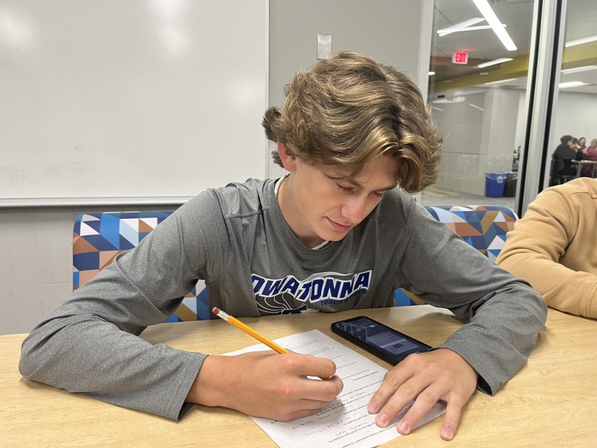 Owatonna sophomore Landon Amundson finishing up some history homework. 