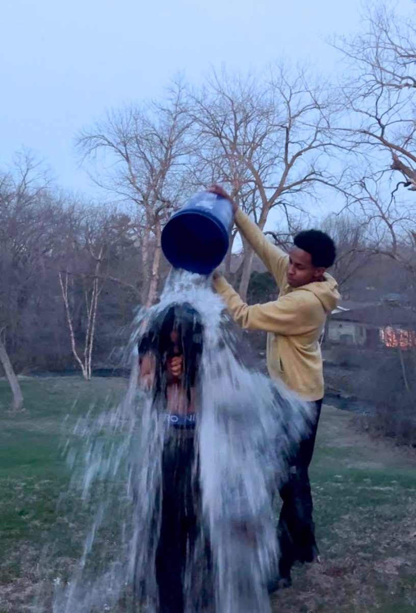 Yahya Dahir (11) pouring ice water on Naomie Delarosa’s (11) to support awareness about mental health.
