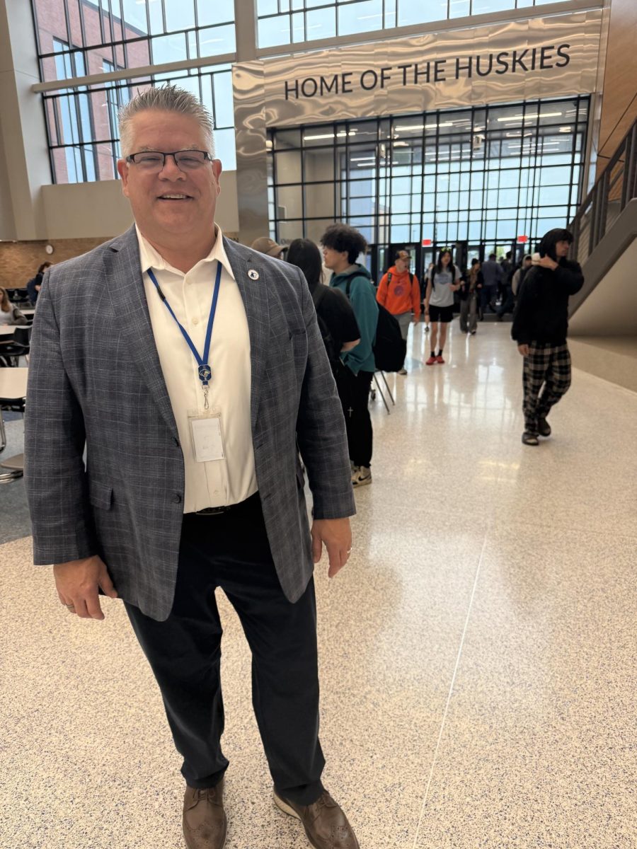 Mr. Elstad standing in the OHS commons. 