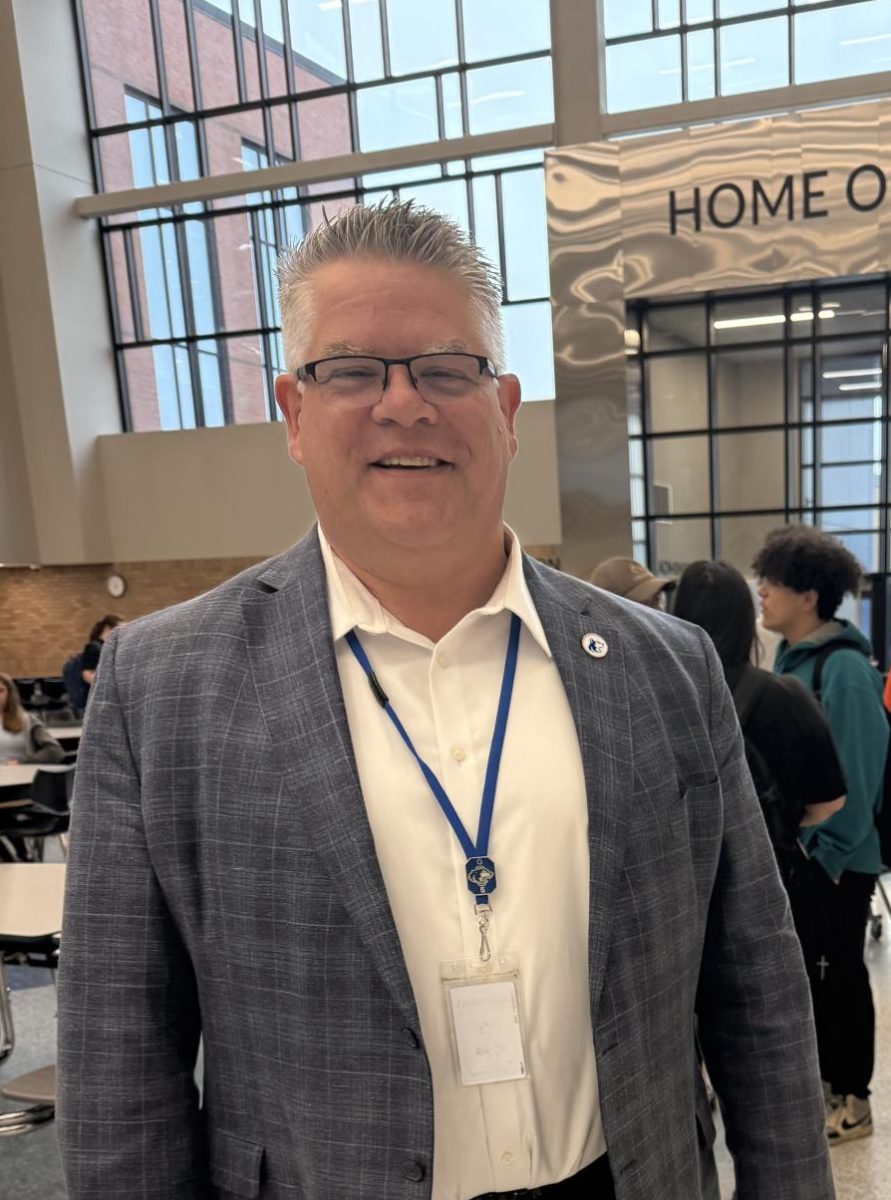 Mr. Elstad standing in the OHS commons. 