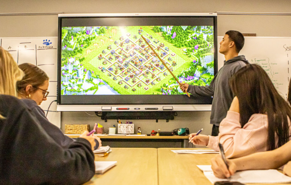 Students study strategy in Clash of Clans.
