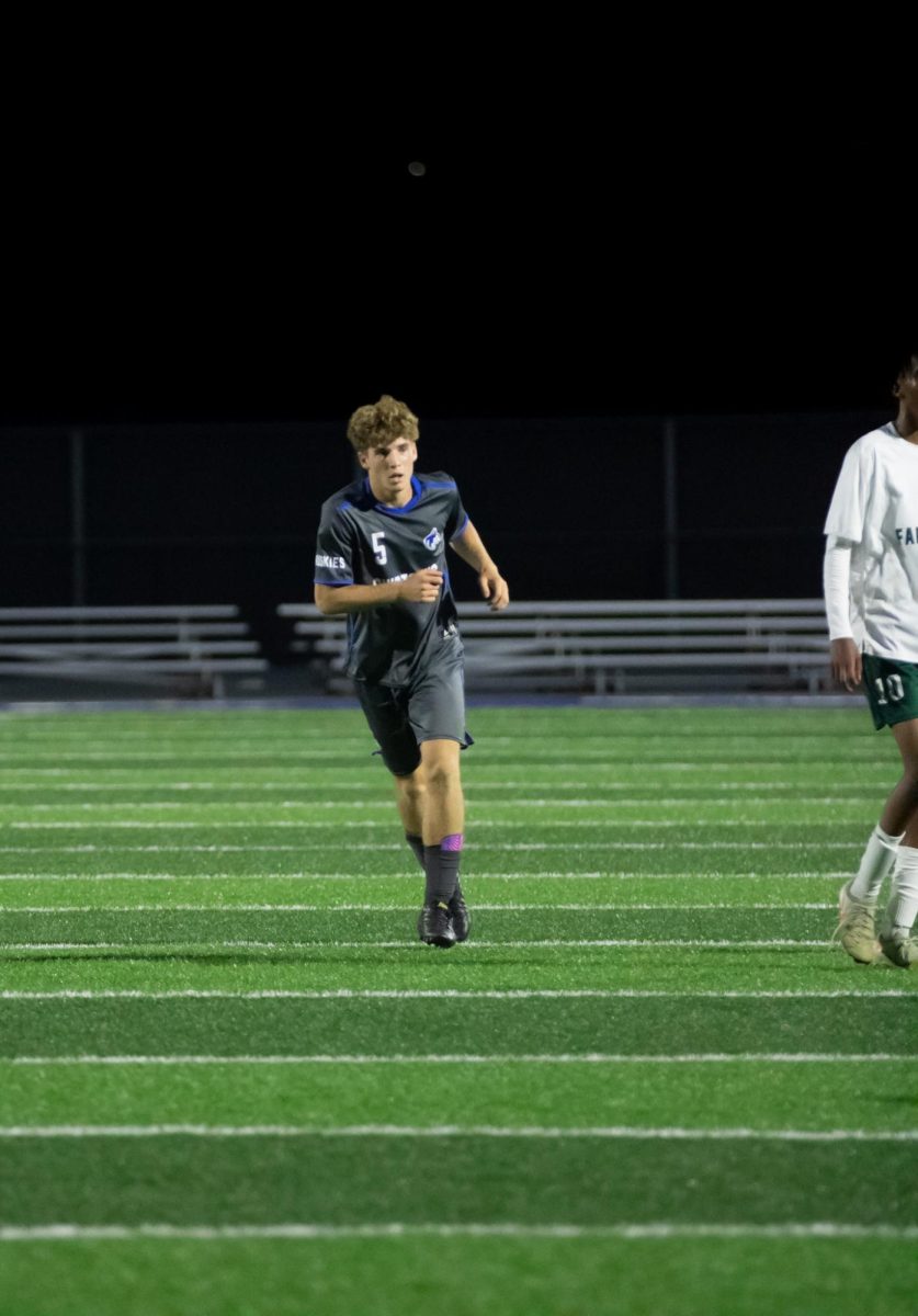 Senior Andrea Bonfanti, foreign exchange student from Italy, playing left back at a home soccer game against neighboring town, Faribault. 