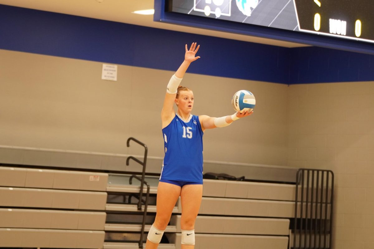 Senior Captian Kyleah Miller getting ready to serve in front of the home crowd.