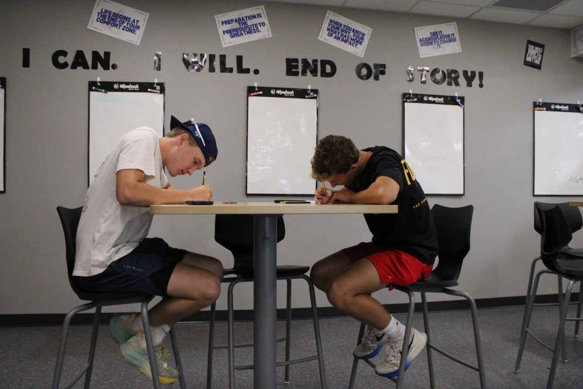 Seniors Will Radel (left) and Gabe Piepho (right) doing a woods 2 assignment.
