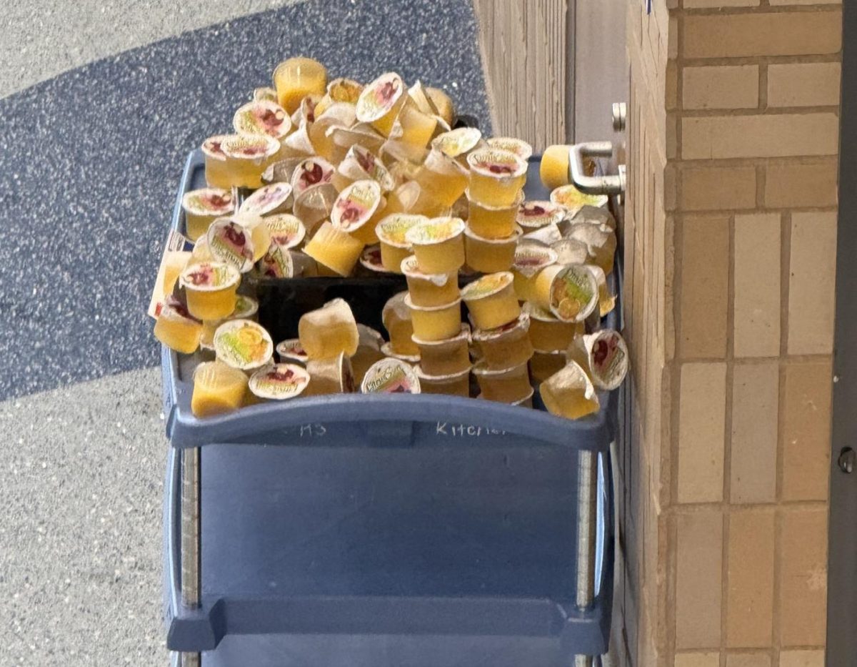 The cart next to the cafeteria exit where students can put their juices they do not want.