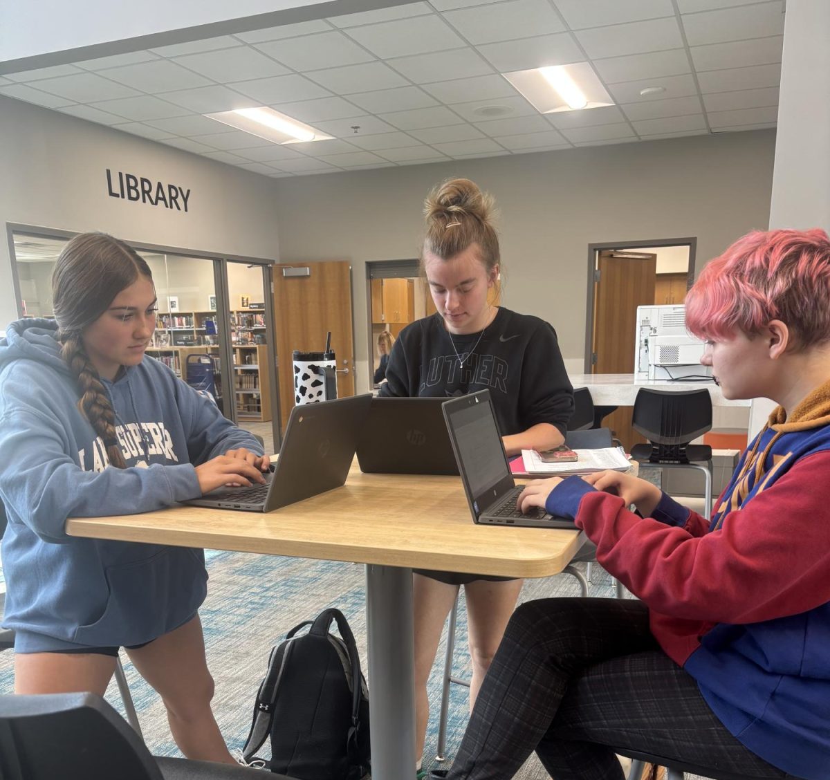 Chloe Gfrerer and Jamie Fiedler working on English work