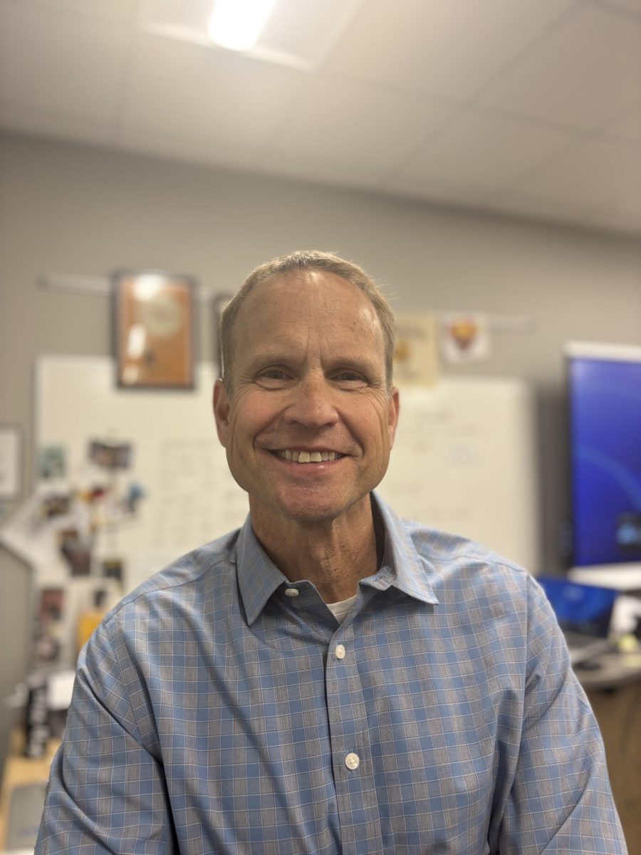 Mr. Leer smiles for the Camara as he continues his work as language arts teacher/ yearbook advisor at OHS 
