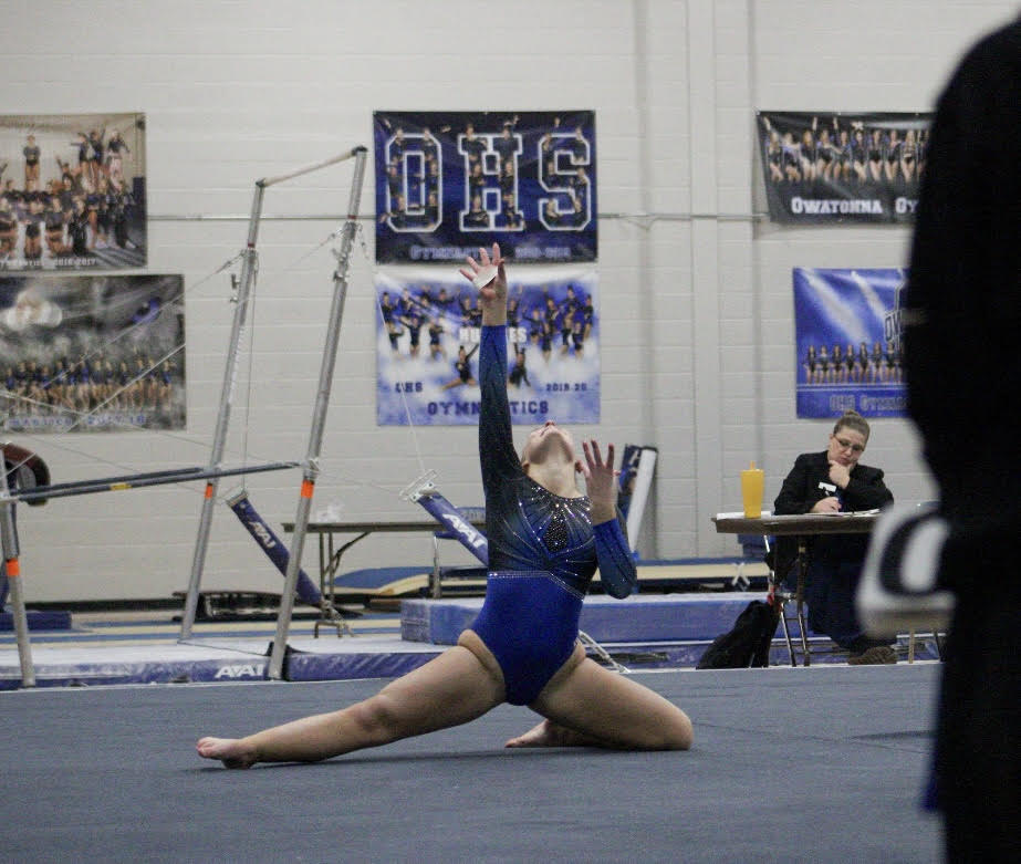 Junior Alivia Sturges performing floor routine at home opener meet. 