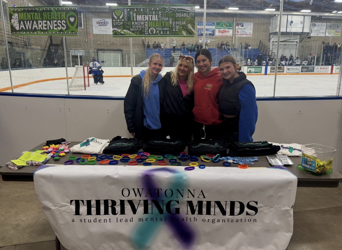 Members of Thriving Minds helping out at the girls hockey mental health night.
