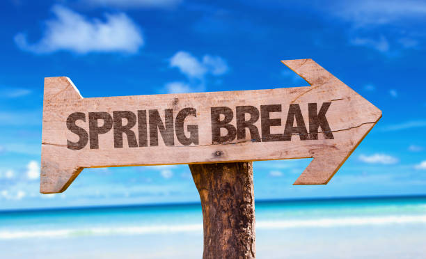 Spring Break sign with beach background.