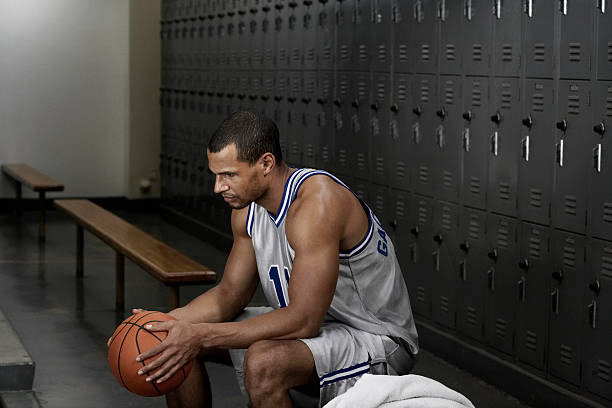 Stressed athlete in the locker room.